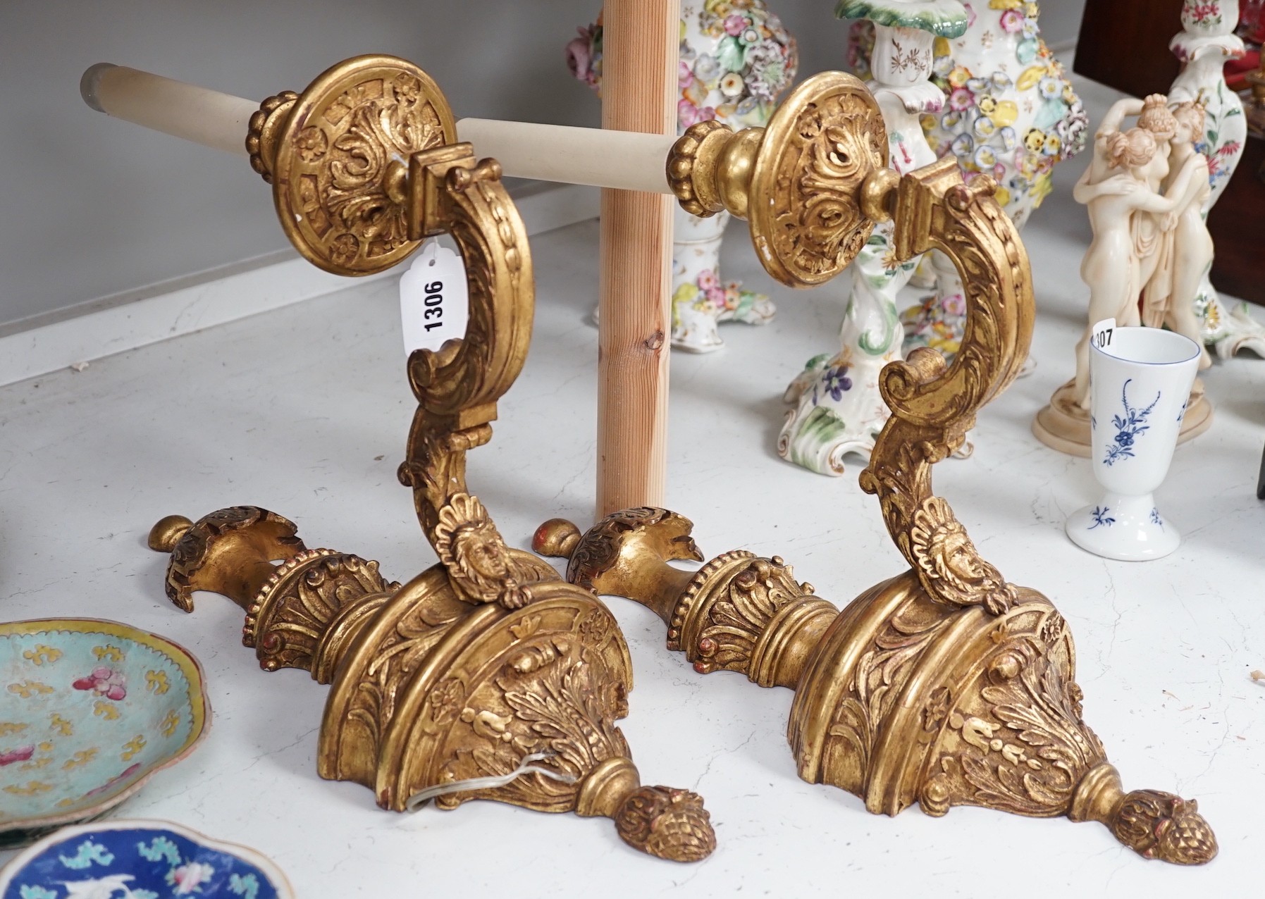 A pair of giltwood decorative single branch wall sconces - approx 50cm long